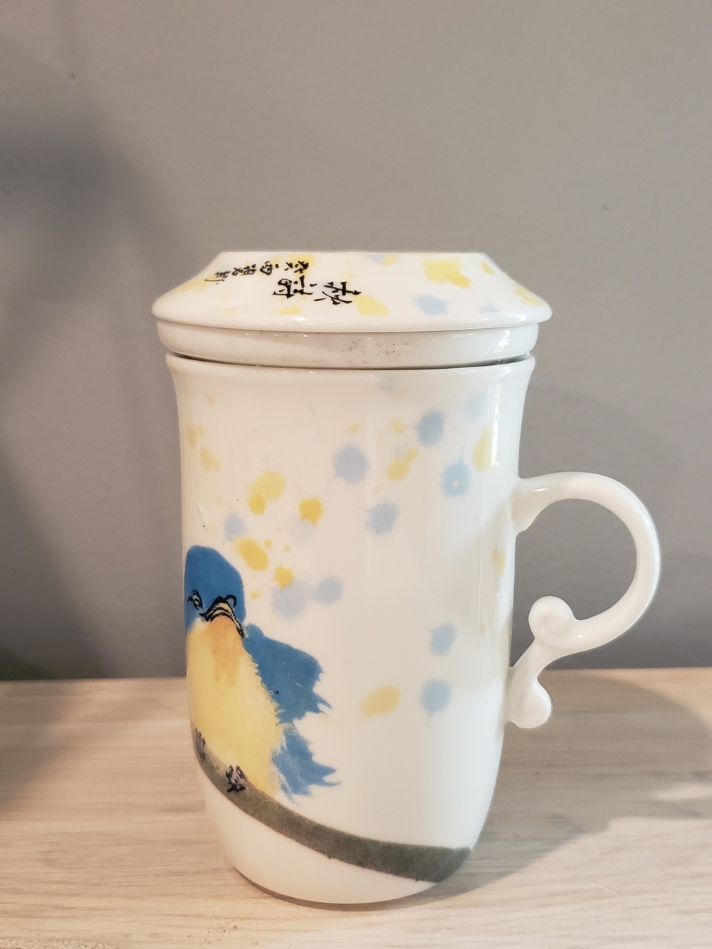 Whimsical White Ceramic Tea Infuser with Blue & Yellow Bird Motif - Picture 5 of 5
